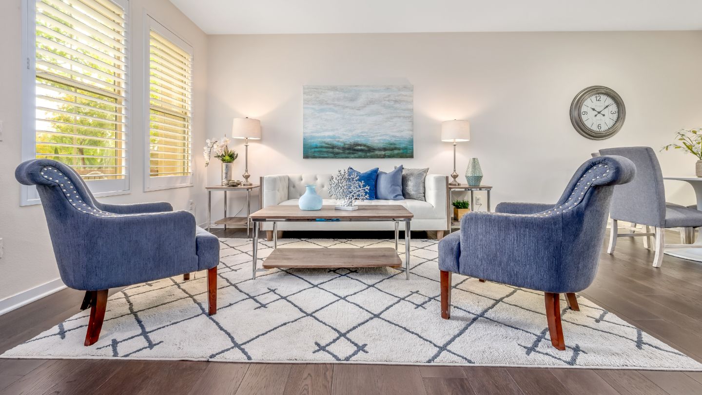 Beautifully cleaned living room with spotless floors and organized furniture